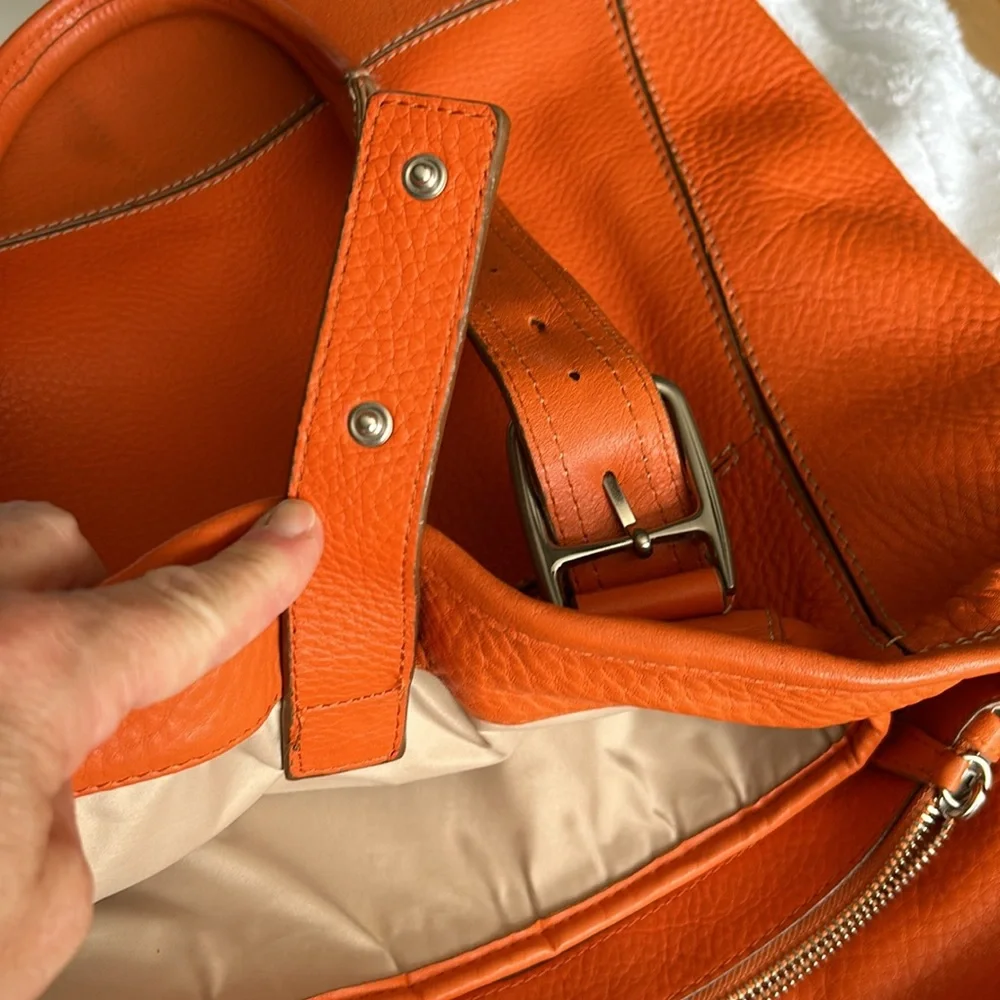 Large leather Cole Haan orange shoulder bag with silver hardware buckles. - Picture 16 of 16